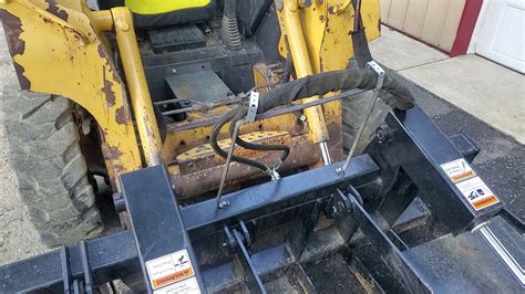 hydraulic hose saver for skid steer|skid steer hydraulic hose holder.